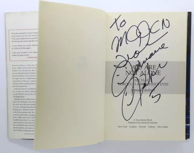 迈克尔·杰克逊三哥杰梅恩·杰克逊亲笔签名书《你不孤单，迈克尔：哥哥眼中的你》.webp.jpg